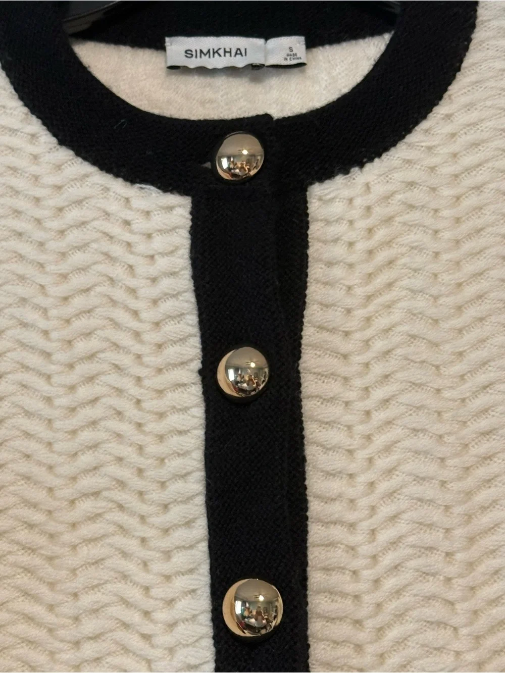 SIMKHAI cream Cropped Cardigan with Black Contrast Trim and gold bottoms size S